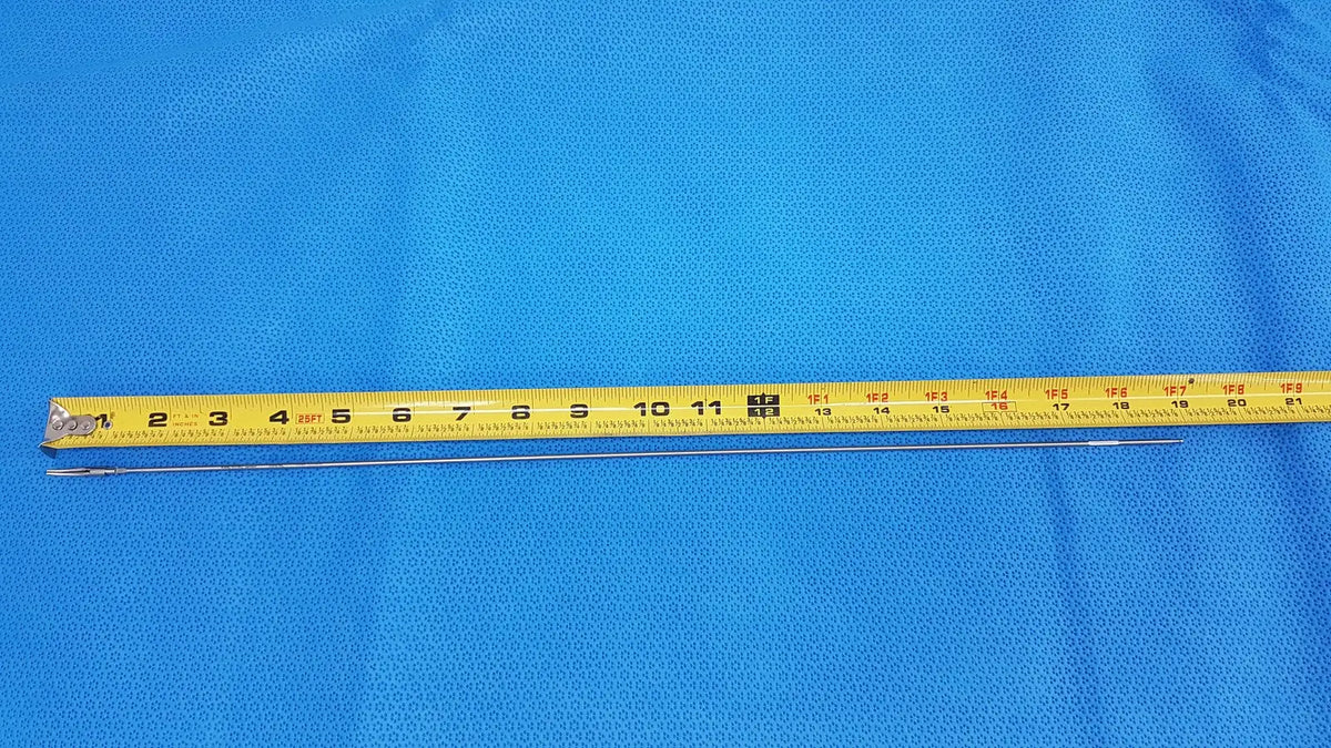 Yellow measuring tape with black markings and metallic blade featured with karl storz laparoscopic grasper model 33410ml