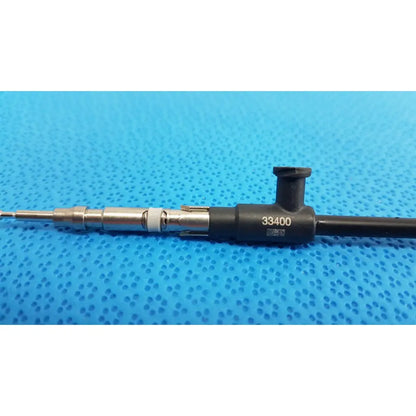 Black and silver karl storz laparoscopic sheath model 33400 featuring a fuel injector design for surgical use