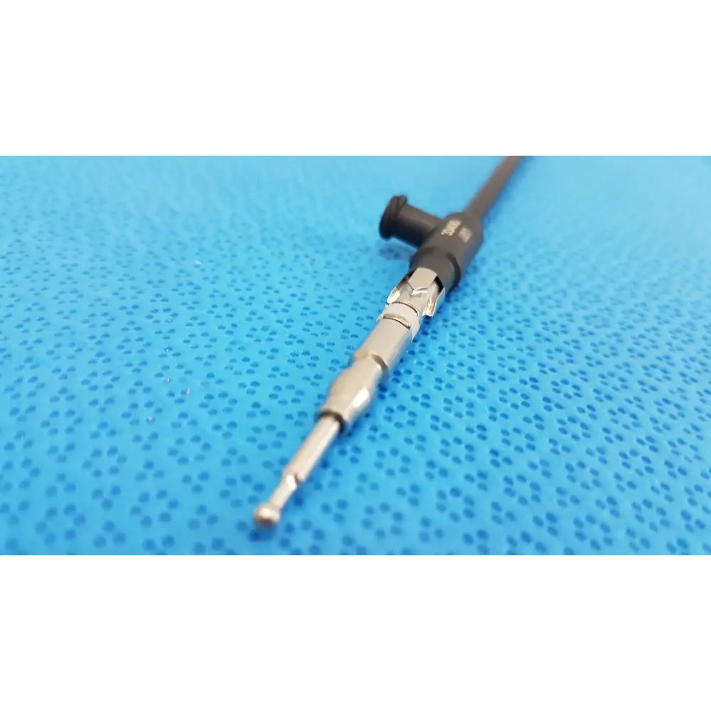 Black and silver karl storz laparoscopic sheath model 33400 with textured grip and threaded metallic shaft