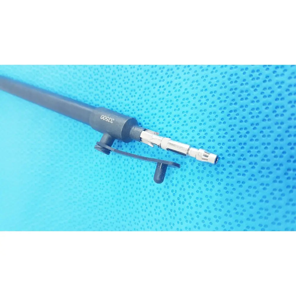 Black and silver karl storz laparoscopic surgical instrument with textured grip labeled 30500 near the handle model 33500