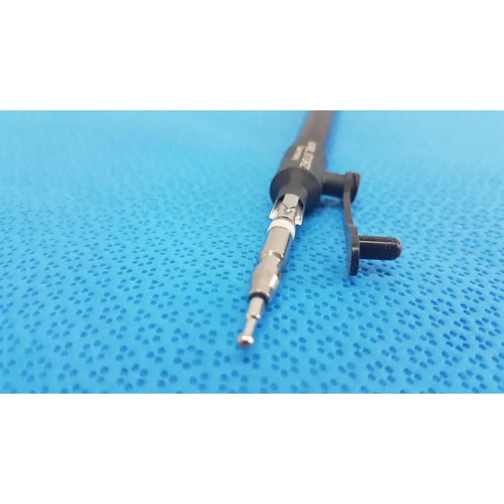 Karl storz laparoscopic surgical instrument model 33500 black and silver with textured grip and plastic clip