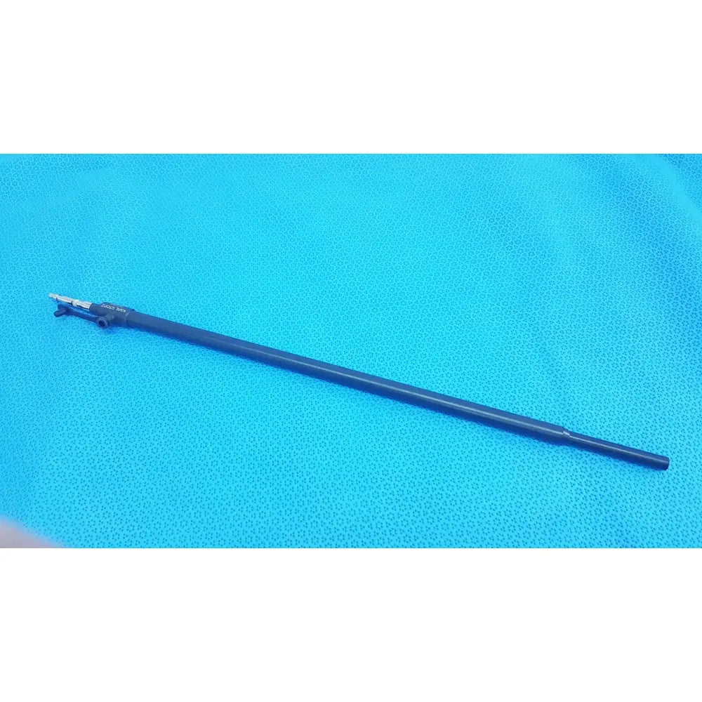 Black karl storz laparoscopic surgical instrument with metallic tip and engraved markings model 33500