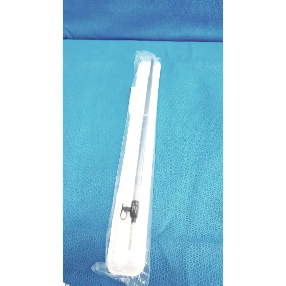 A sterile white plastic wrapped karl storz ref 33500m clickline metalouter tube with black mechanical part and metal tip
