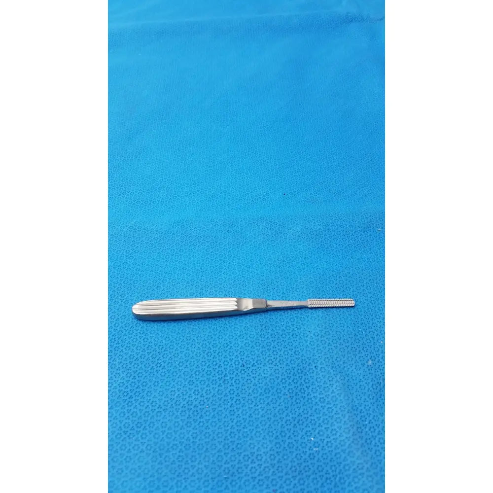 Silver karl storz stainless steel n4525 surgical instrument with textured grip and fine serrated tip for precision use