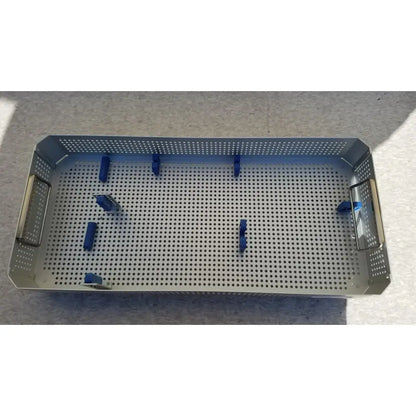 Stainless steel karl storz sterilization container case with perforated tray and blue plastic clamps for instrument sterilization