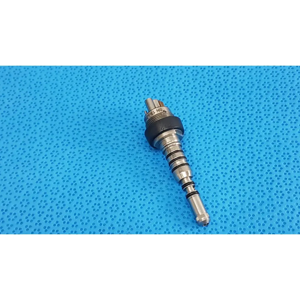 Silver surgical instrument with black rubberized grip and threaded metallic shaft for kavo pin 460led coupler dental use