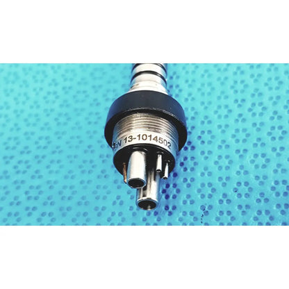 Silver metallic KAVO 460 LED MULTIflex LUX 6-pin coupler with black rubber seal and three ports for dental handpiece connection