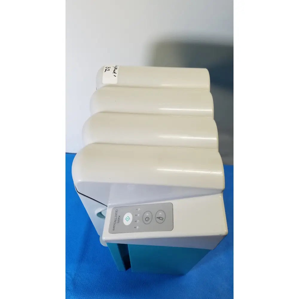 Cream-colored compact electric space heater with control panel for power and temperature in kavo quattrocare 2104a dental unit