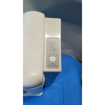 White kavo quattrocare 2104a dental handpiece maintenance unit with sleek ergonomic design and illuminated control panel buttons