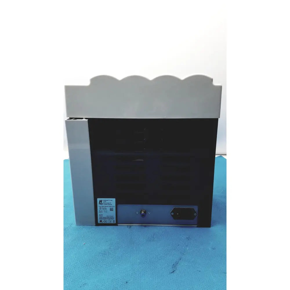 Gray and black industrial-grade printer with scalloped top edge for kavo quattrocare plus handpiece maintenance system