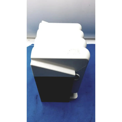 White and black plastic kavo quattrocare plus 2124 a handpiece maintenance system box with rounded edges and hinged lid
