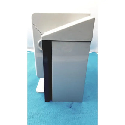 Gray plastic desktop printer with black side panel and white top cover for kavo quattrocare plus handpiece maintenance system