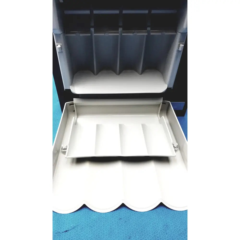 White plastic cash register tray with scalloped edges and compartments for kavo quattrocare plus handpiece maintenance
