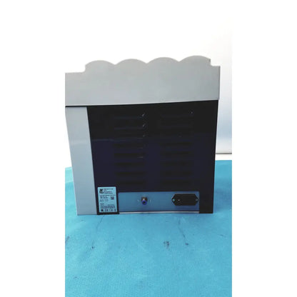 Gray and black industrial handpiece maintenance system with scalloped top edge kavo quattrocare plus 2124a plus 2124a