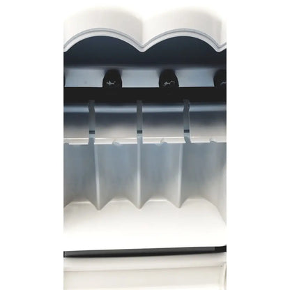 White plastic ice maker with scalloped top and multiple slots for ice cubes in kavo quattrocare plus 2124a system