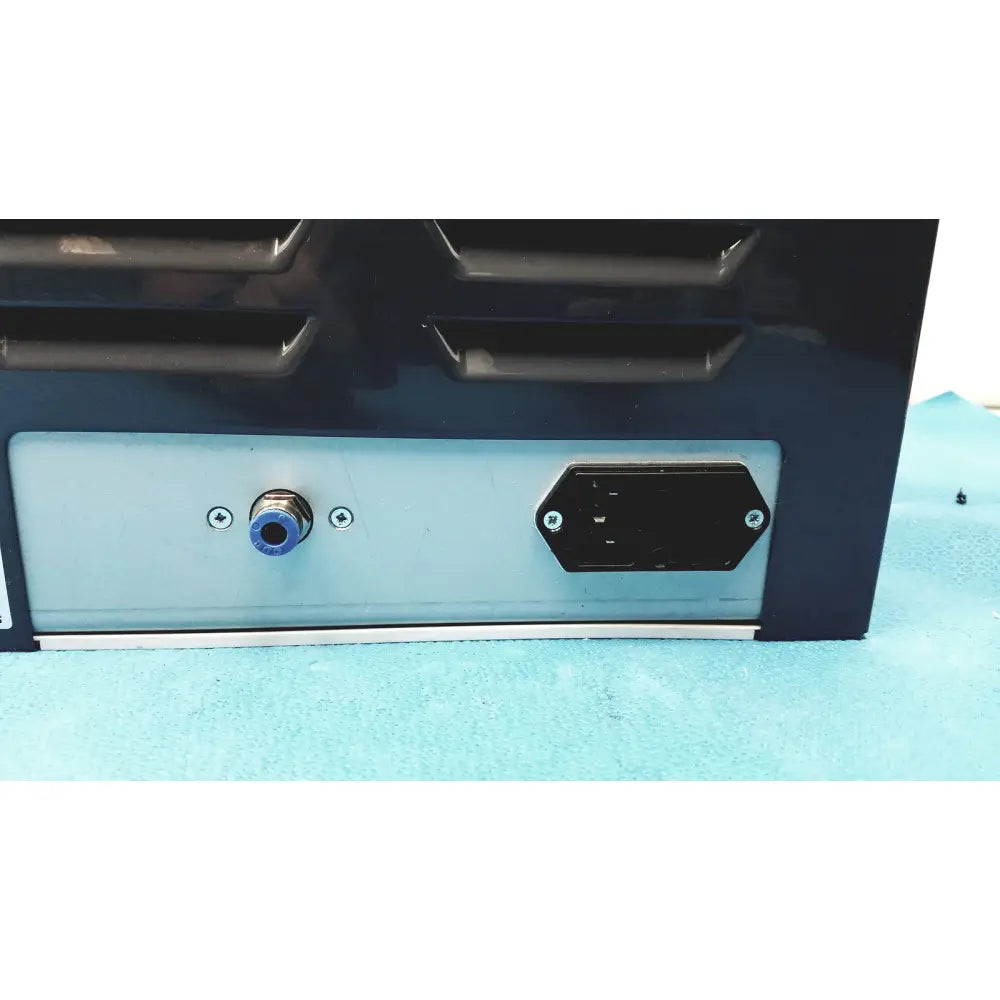 Black industrial power supply unit with light blue panel and connectors for kavo quattrocare plus 2124a handpiece system back side