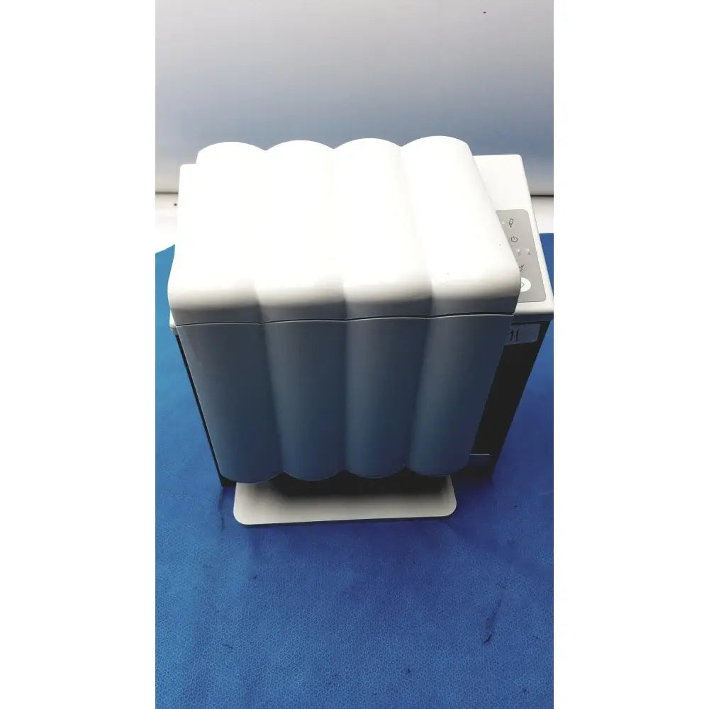 White and gray wave-patterned plastic printer cover for kavo quattrocare plus 2124a handpiece maintenance system