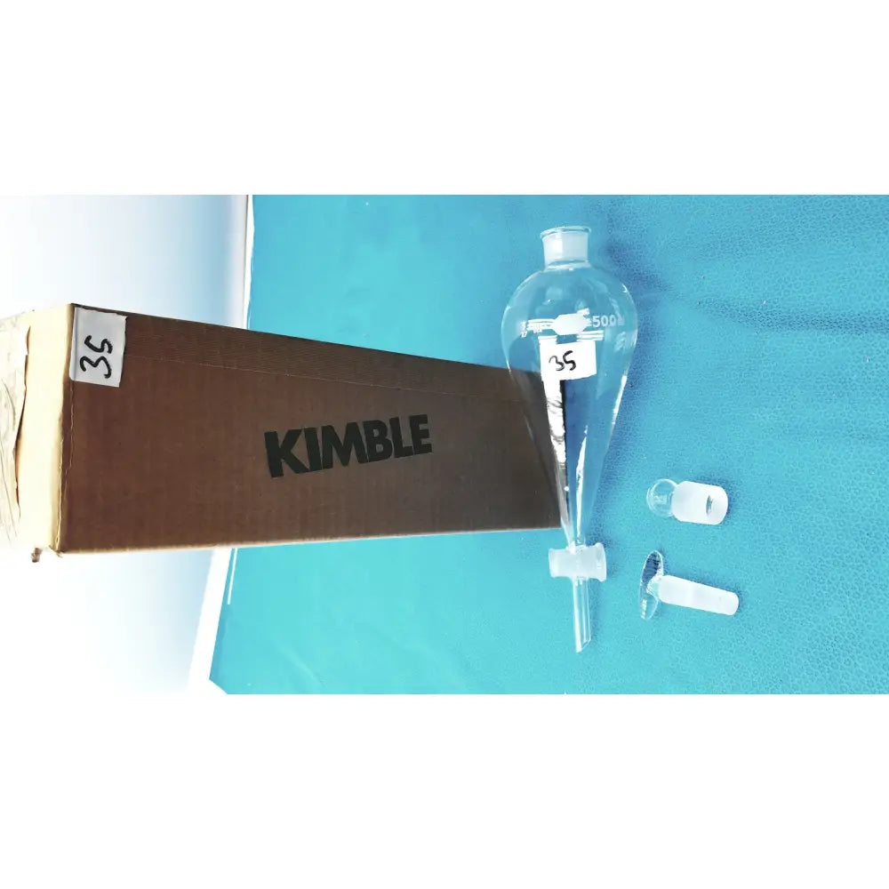 Clear glass kimax glass separatory funnel 500 ml with narrow neck, graduated markings, PTFE stopcock, and glass stopper