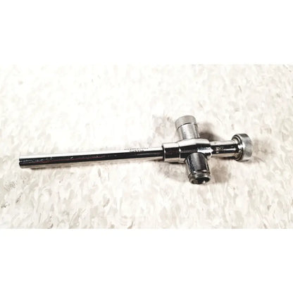 Shiny chrome-plated reusable metal trocar sleeve with long cylindrical shaft and two threaded connectors end