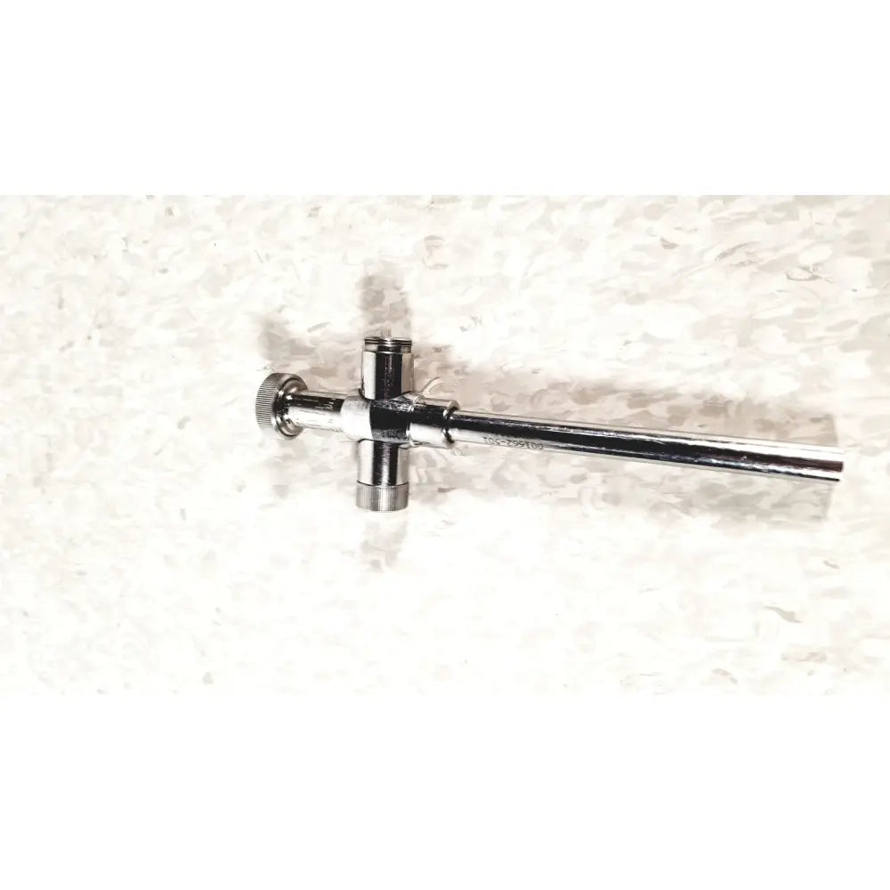 Shiny chrome-plated brass reusable metal trocar sleeve with cross-shaped valve and knurled adjustment knob