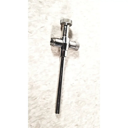 Shiny chrome-plated brass plumbing valve with cross-shaped body and threaded ends for reusable metal trocar sleeve use