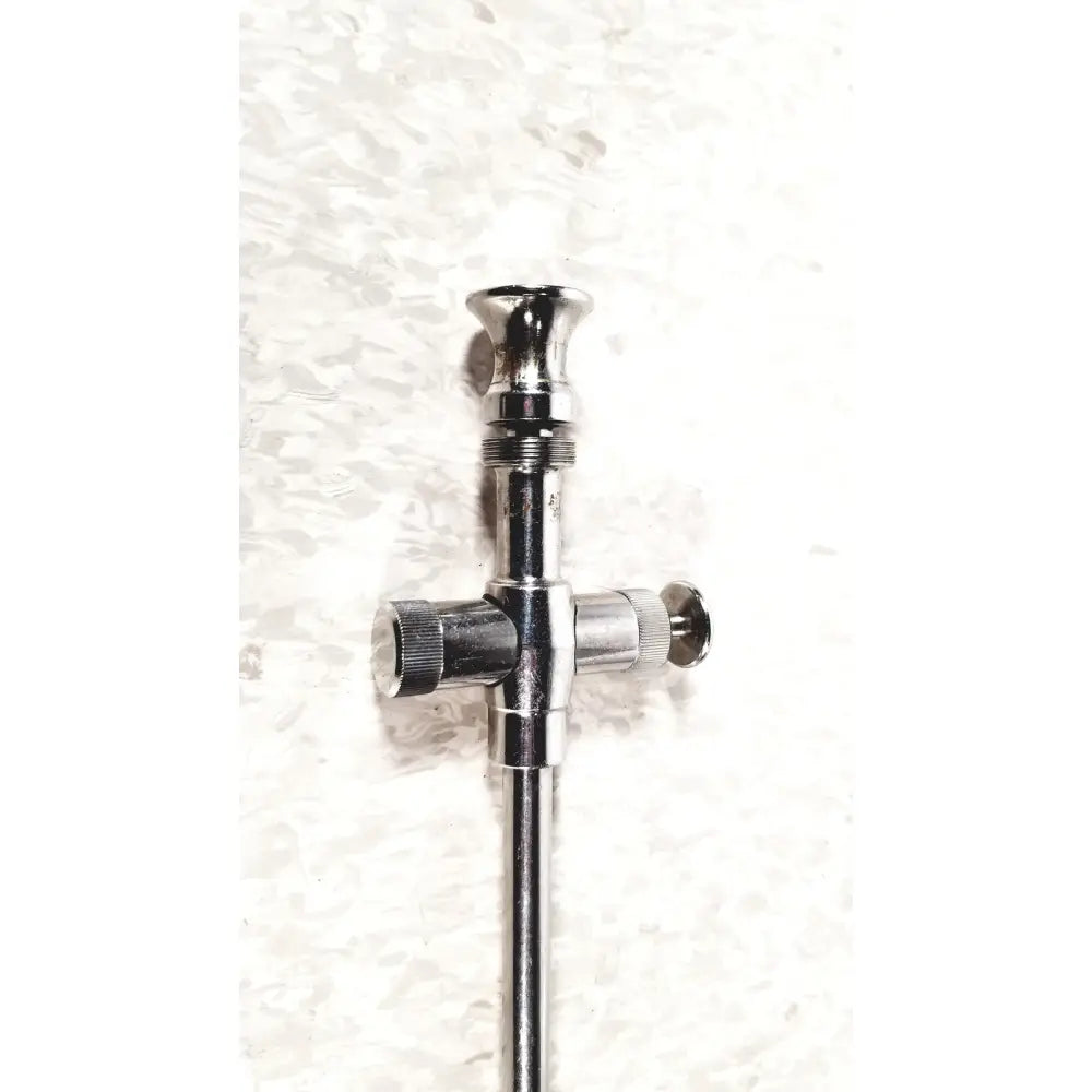 Chrome-finished reusable metal trocar sleeve with cross-shaped handle and three adjustable knobs for surgical use
