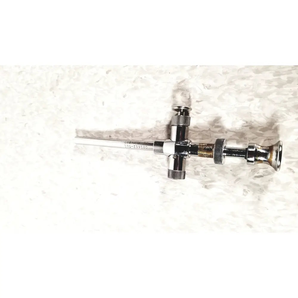Chrome-finished reusable metal trocar sleeve sli 8mm with cross-shaped handle and engraved serial number kli 001662-501