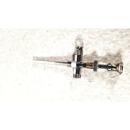 Chrome-finished reusable metal trocar sleeve sli 8mm with cross-shaped handle and engraved serial number kli 001662-501