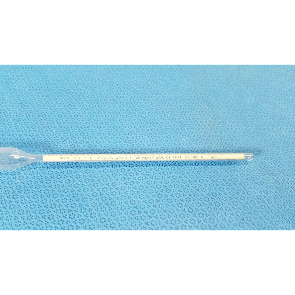A clear glass ko specific gravity hydrometer with white scale for measuring heavy light liquids temp 60°f