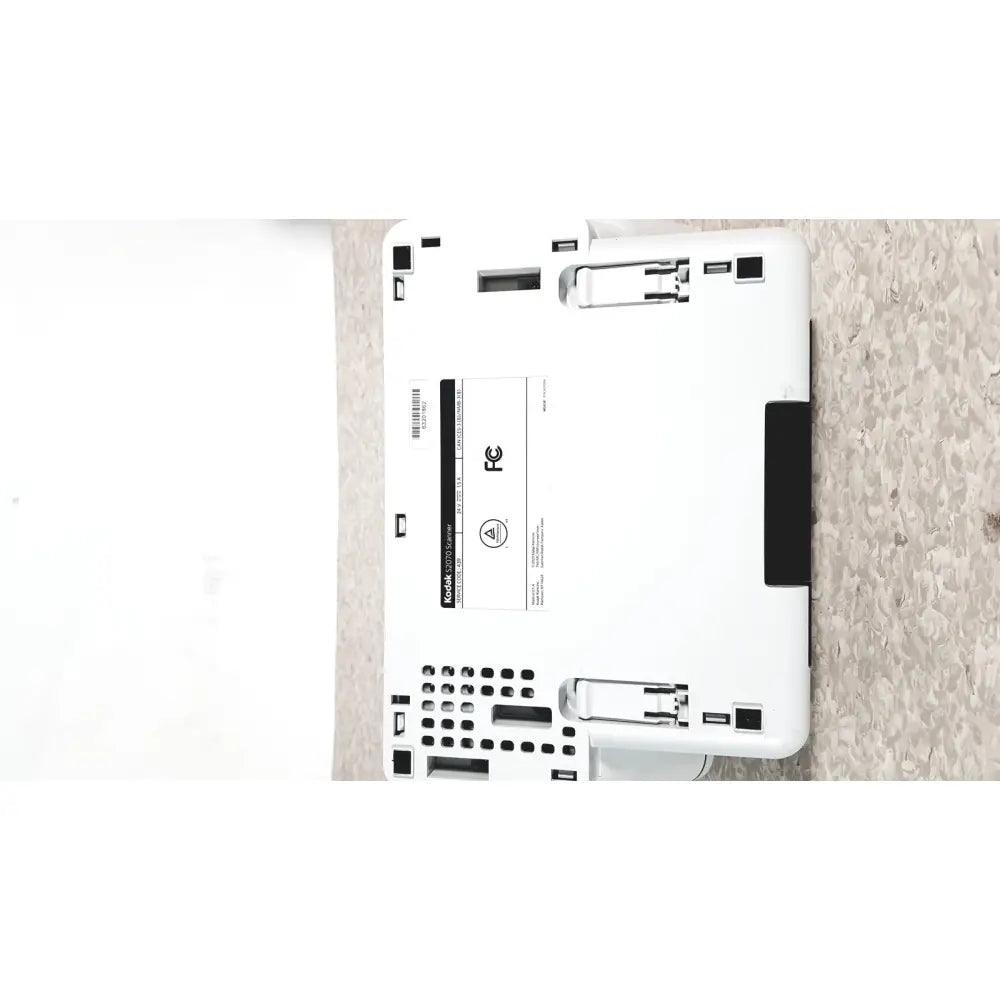 White kodak easyshare c2030 printer with black accents and label showing model number and fcc certification for alaris s2070 high speed use