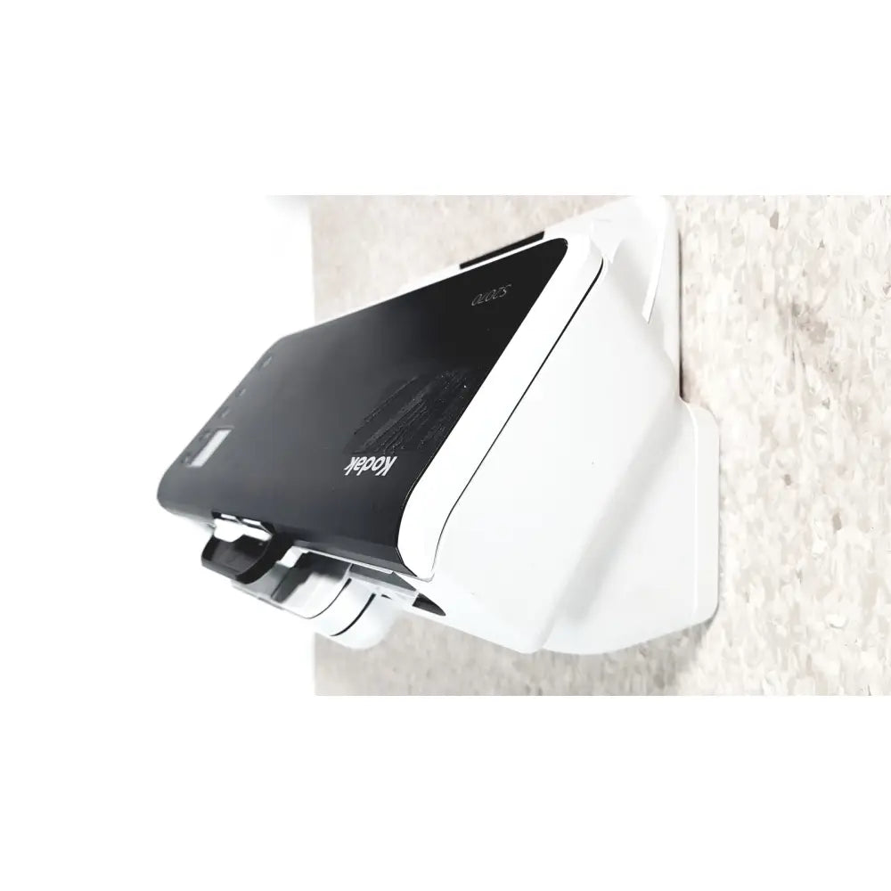 White and black kodak easyshare digital photo printer mounted on wall with kodak alaris s2070 high speed scanner