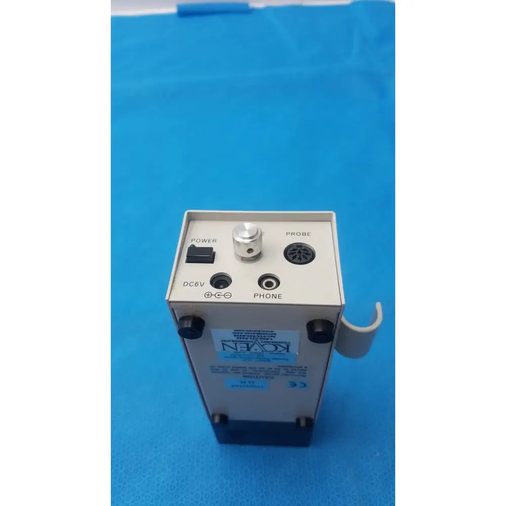 White rectangular medical device with black knobs ports and silver rotary dial probe labeled from koven wave hadeco model es-1000spm