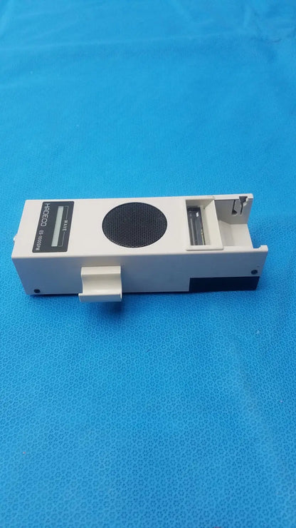 White rectangular koven wave hadeco electronic device with black circular grille model 80-dc300h for wave hadeco moel es-1000spm