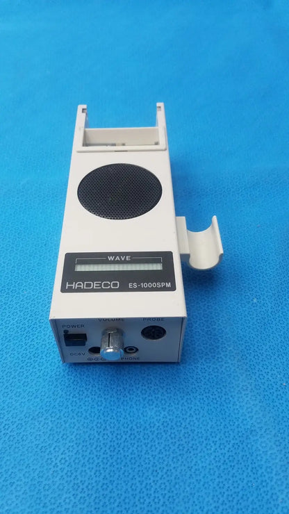 White koven wave hadeco es-1000spm portable speaker with black grille and side clip for easy carrying