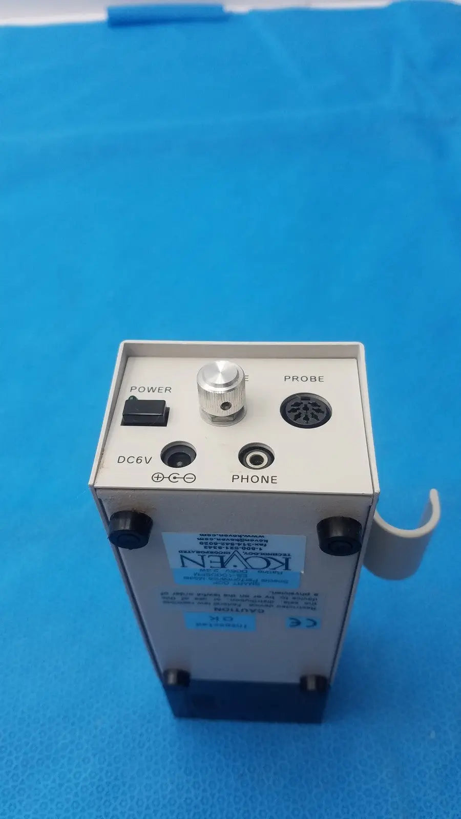 White rectangular medical device with black knobs ports and silver rotary dial probe labeled from koven wave hadeco model es-1000spm