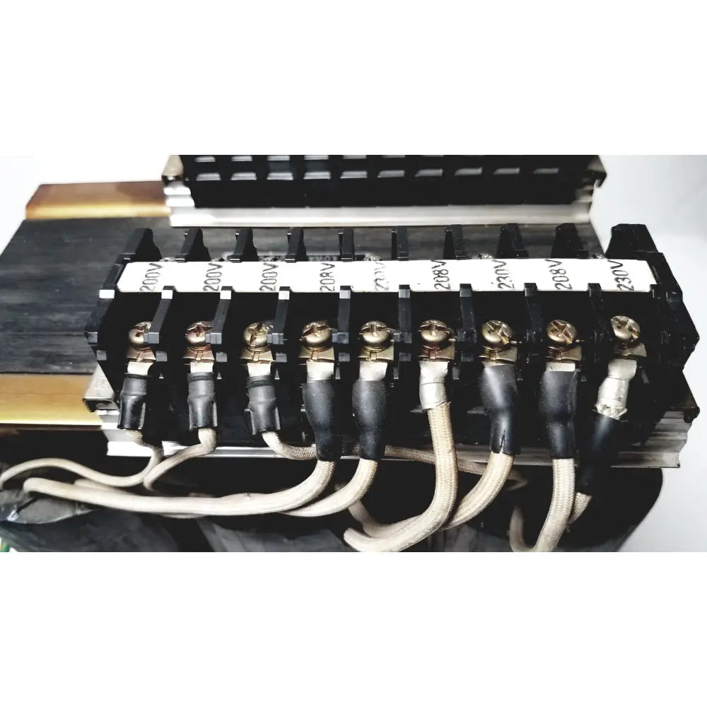 Black electrical terminal block with gold screws and labeled insulators for 208v connected to kowa sangyo power transformers