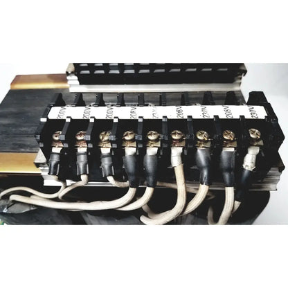 Black electrical terminal block with gold screws and labeled insulators for 208v connected to kowa sangyo power transformers