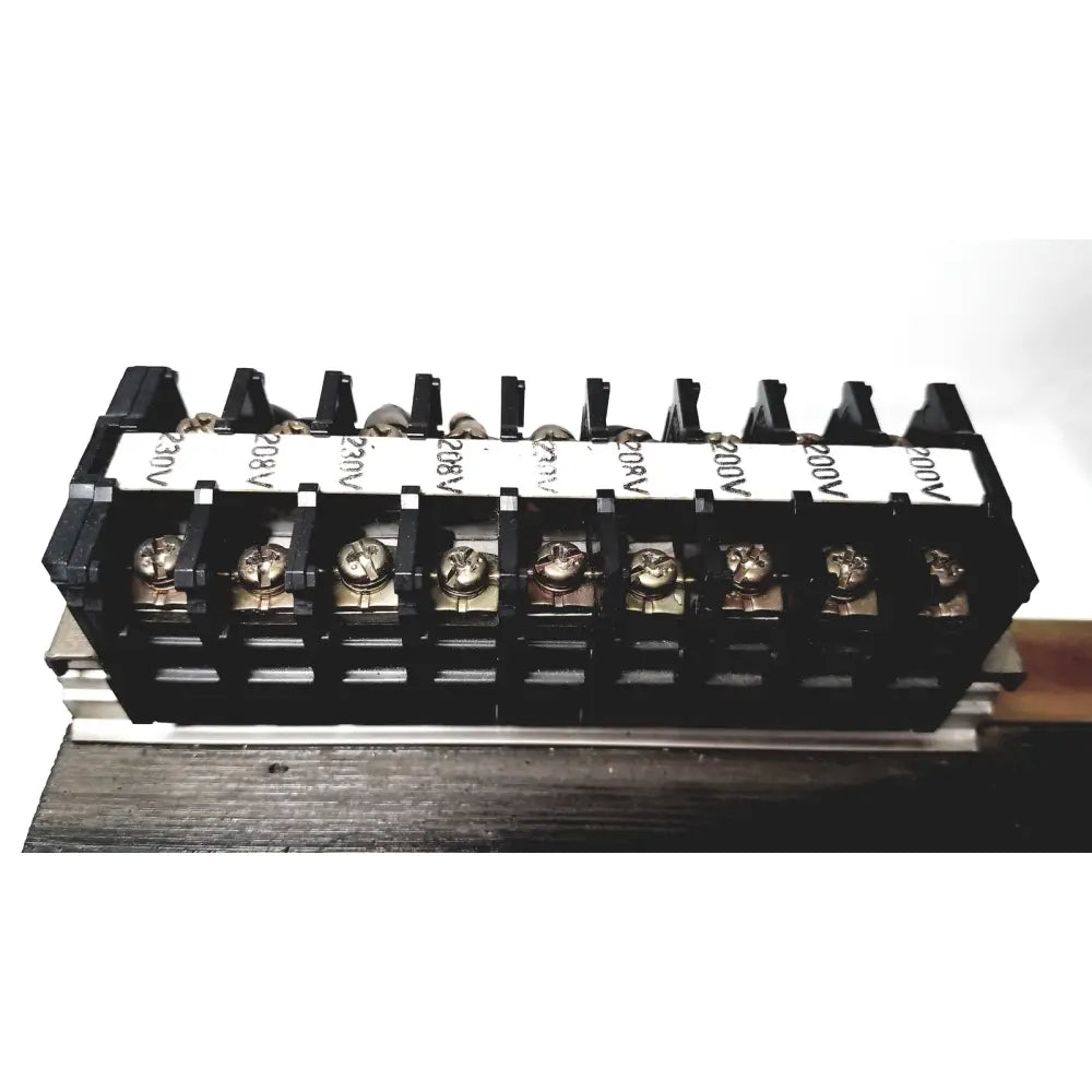 Black plastic terminal block with silver screws and voltage labels for kowa sangyo power transformers in reuse medical settings