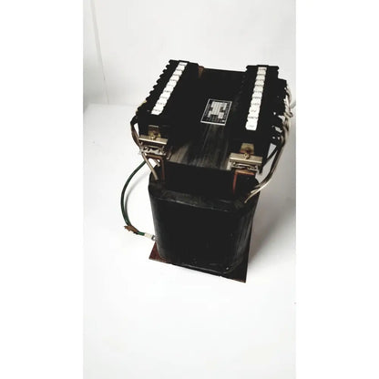 Black industrial power transformer with copper windings and terminal blocks by kowa sangyo for reuse medical applications
