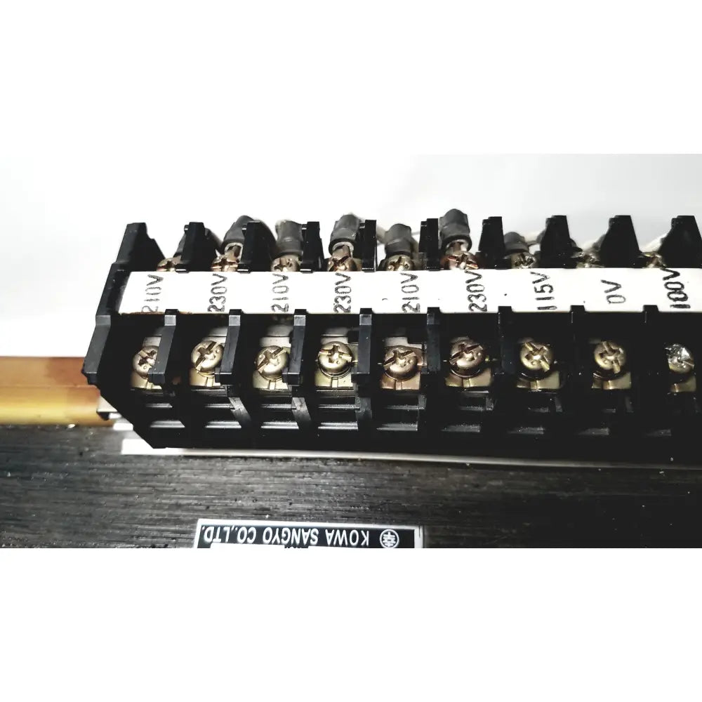 Black plastic terminal block with gold screws and white voltage labels 230v 15v 0v on kowa sangyo power transformer