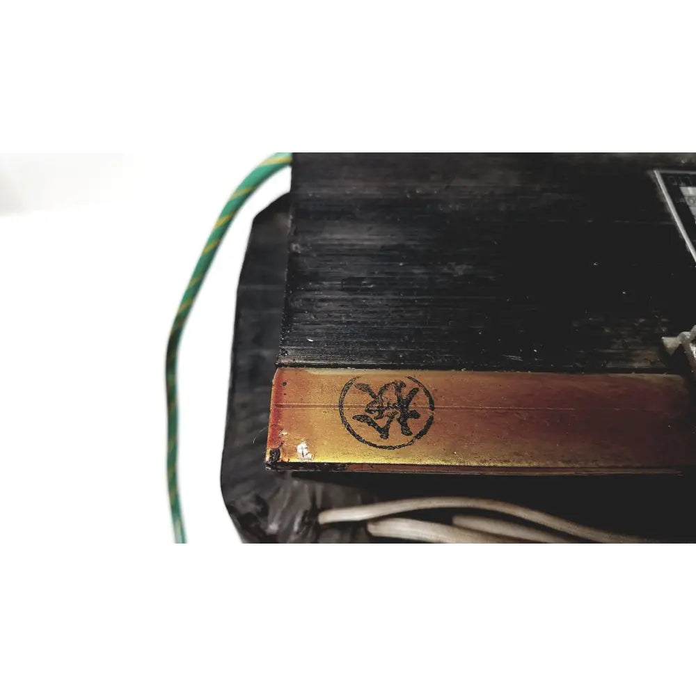 Black rectangular kowa sangyo power transformer with gold metallic strip and embossed circular logo for reuse medical use