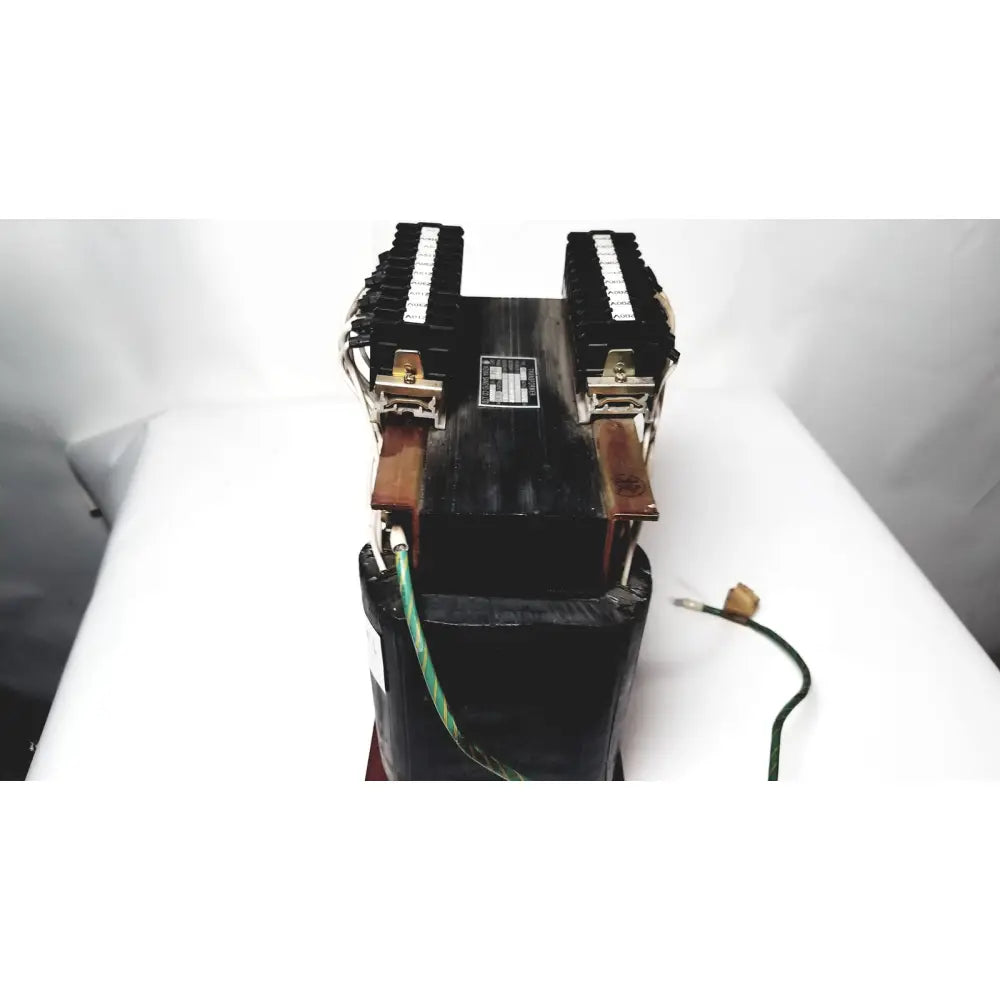 Black industrial power transformer by kowa sangyo with dual terminal blocks and copper-colored clamps for reuse medical use