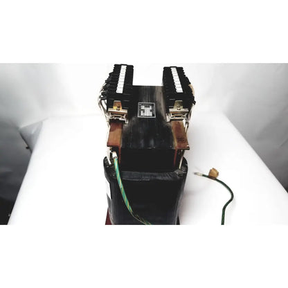Black industrial power transformer by kowa sangyo with dual terminal blocks and copper-colored clamps for reuse medical use