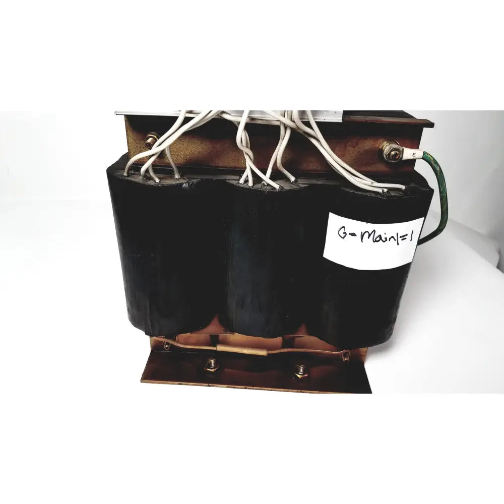 Black cylindrical power transformer by kowa sangyo with copper windings and white wiring labeled g-main=1 for reuse medical