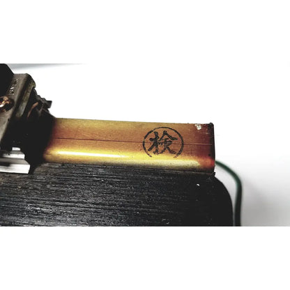 Golden metallic kowa sangyo co ltd transformer with circular stamp featuring chinese character檢 for power transformers reuse medical use