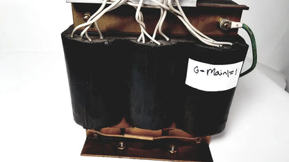 Black cylindrical power transformer by kowa sangyo with copper windings and white wiring labeled g-main=1 for reuse medical