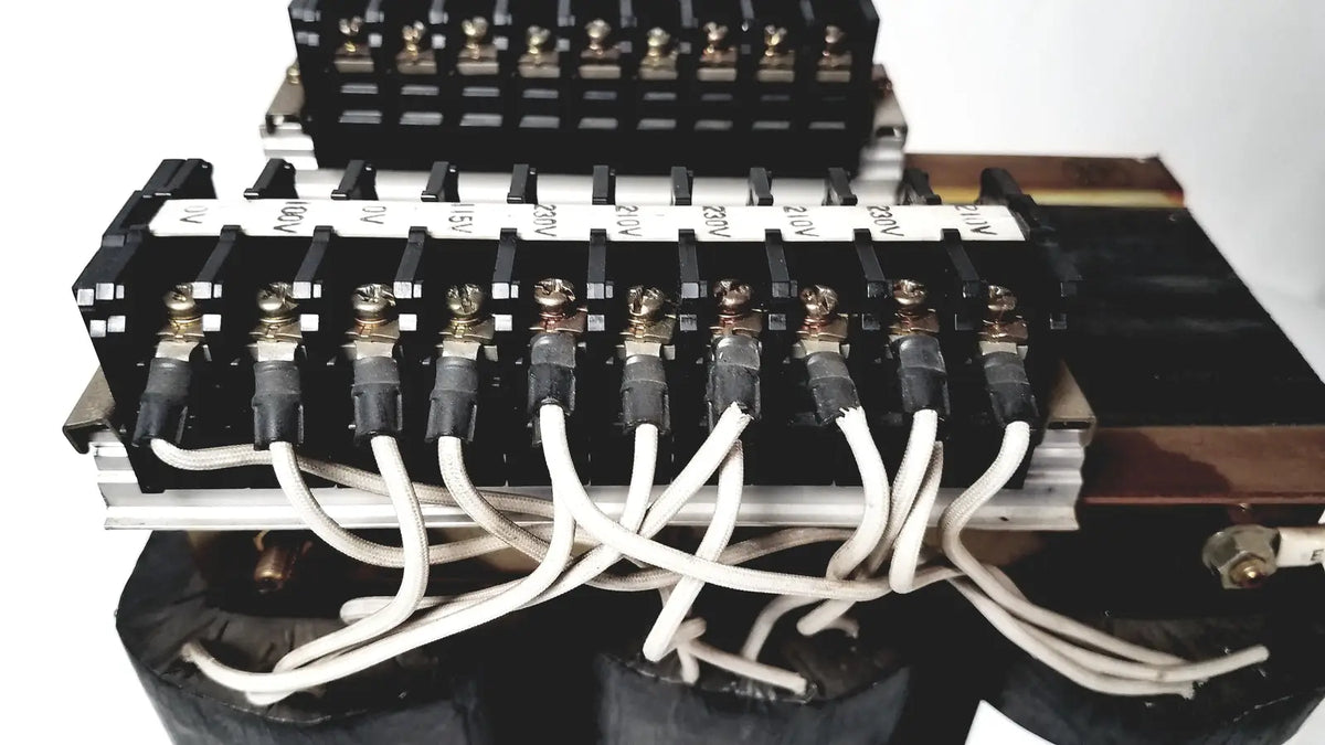 Black electrical terminal block with silver connectors and white wires for kowa sangyo power transformers reuse medical applications