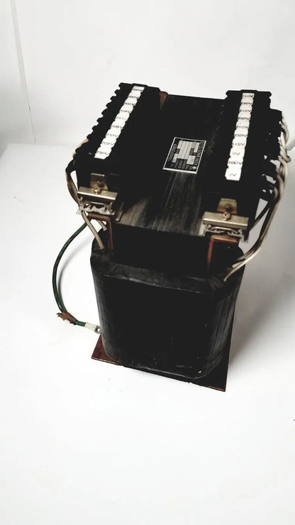 Black industrial power transformer with copper windings and terminal blocks by kowa sangyo for reuse medical applications