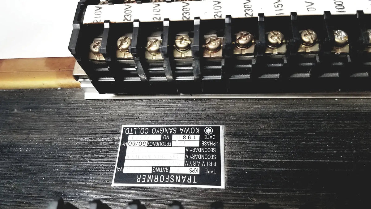 Black rectangular kowa sangyo power transformers label with white text and logo displaying technical specifications
