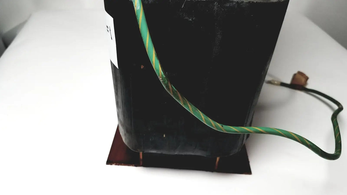 Black rectangular power transformer by kowa sangyo with green and yellow striped wiring for reuse medical power transformers